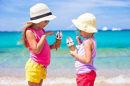 kids on beach with ice cream
