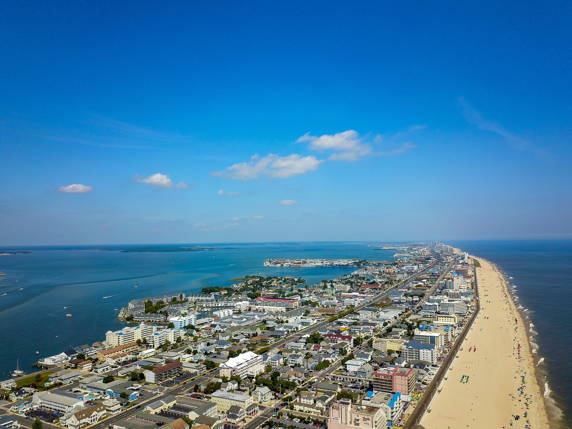 5-reasons-to-book-a-trip-to-ocean-city-md-ocmd-beach-6a29be823c60b.jpg Aerial view of the wide public beach and shoreline in Ocean City, Maryland